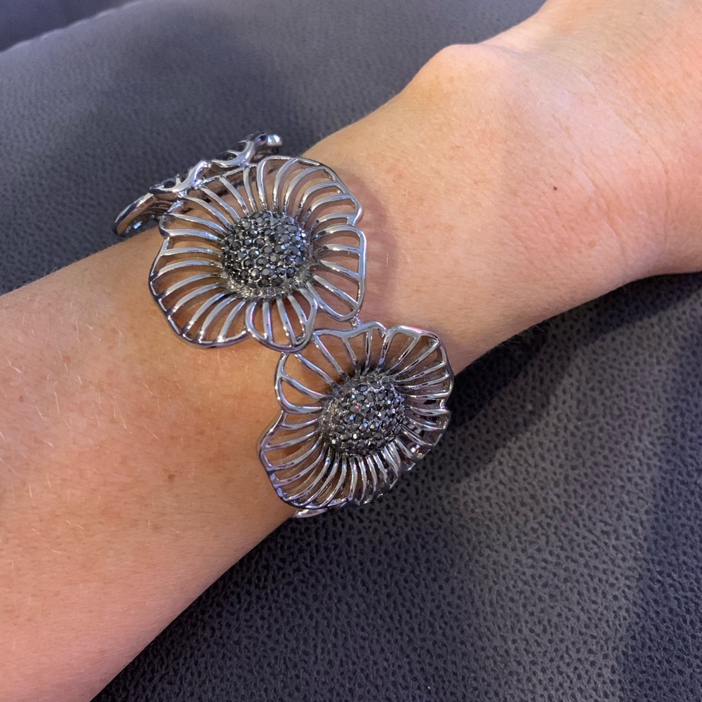 Adjustable silver cuff bracelet floral design with dark grey/black rhinestones